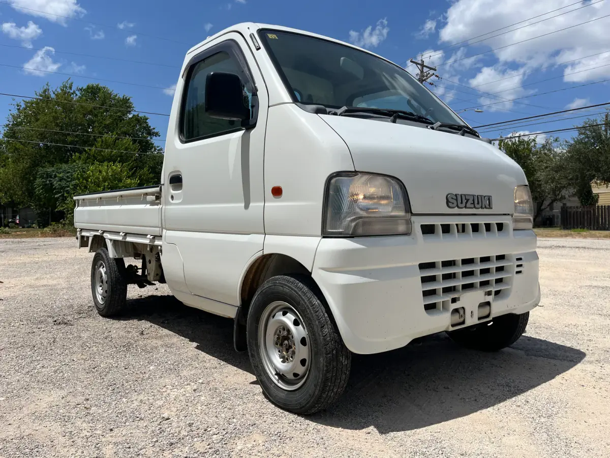 1999 Suzuki Carry, 4WD + AC, a Kei Truck, for sale at Sunshine Imports in Austin, TX (photo 1 of 9)