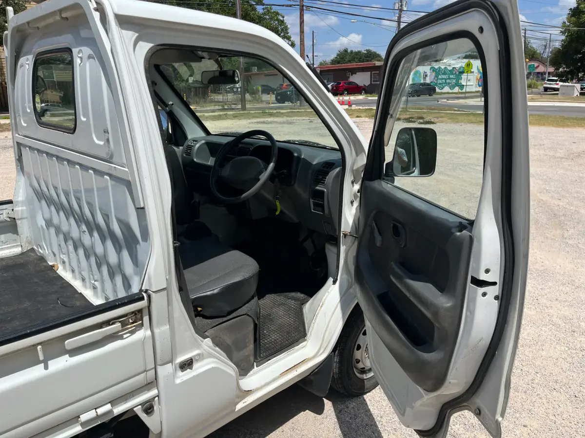 1999 Suzuki Carry, 4WD + AC, a Kei Truck, for sale at Sunshine Imports in Austin, TX (photo 3 of 9)