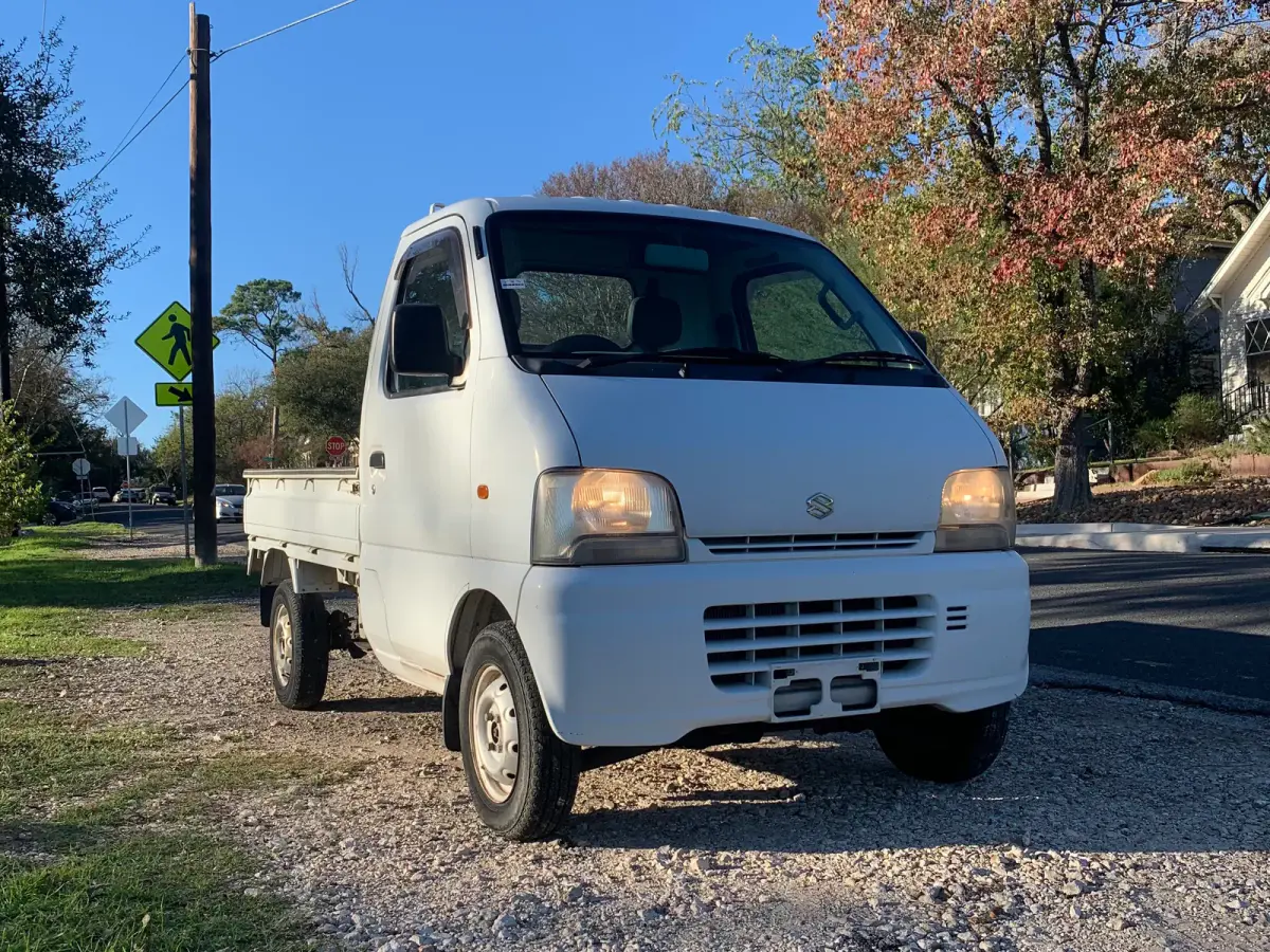 1999 Suzuki Carry, 4WD and AC, a Kei Truck, for sale at Sunshine Imports in Austin, TX (photo 1 of 10)