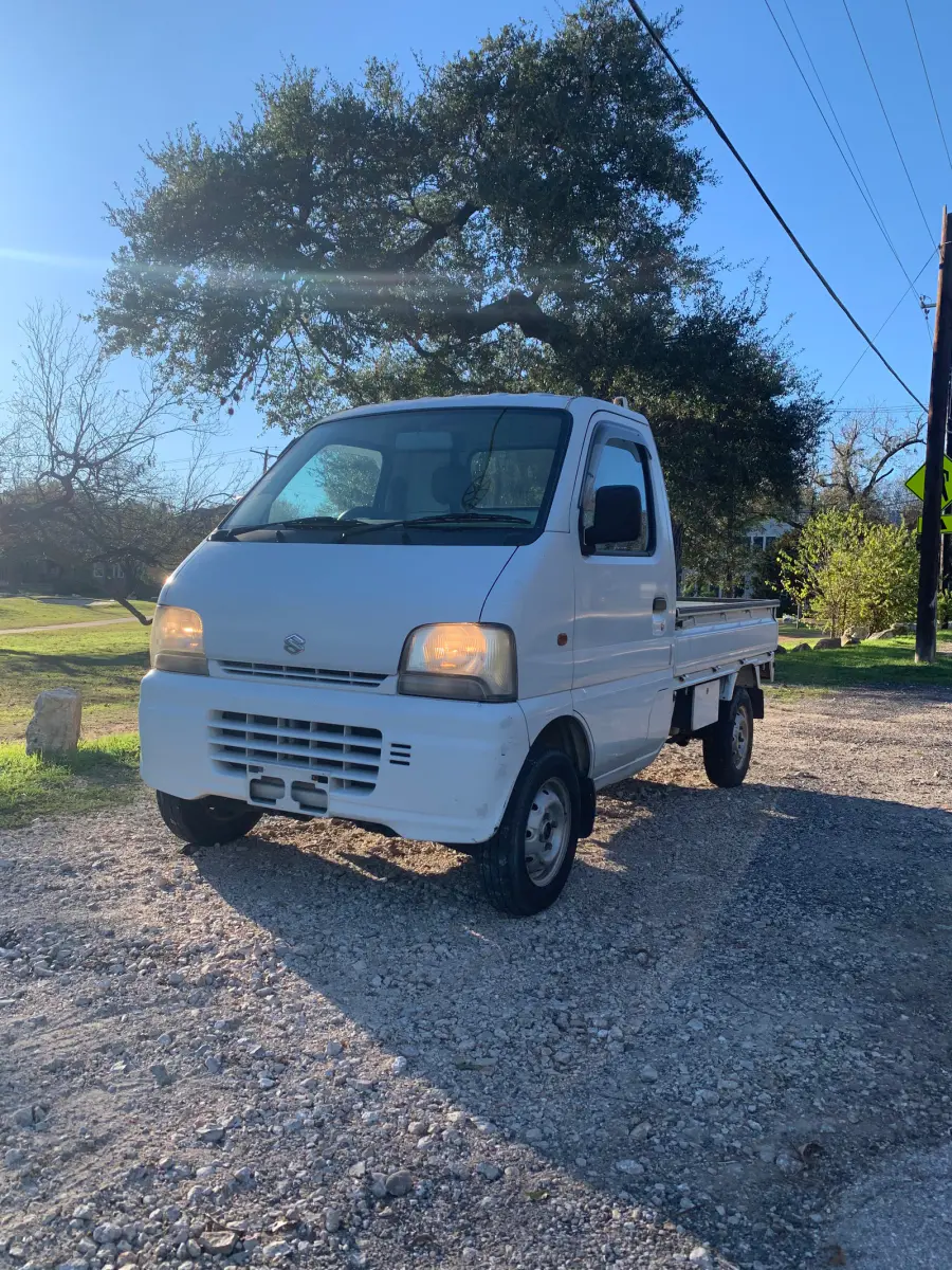1999 Suzuki Carry, 4WD and AC, a Kei Truck, for sale at Sunshine Imports in Austin, TX (photo 2 of 10)