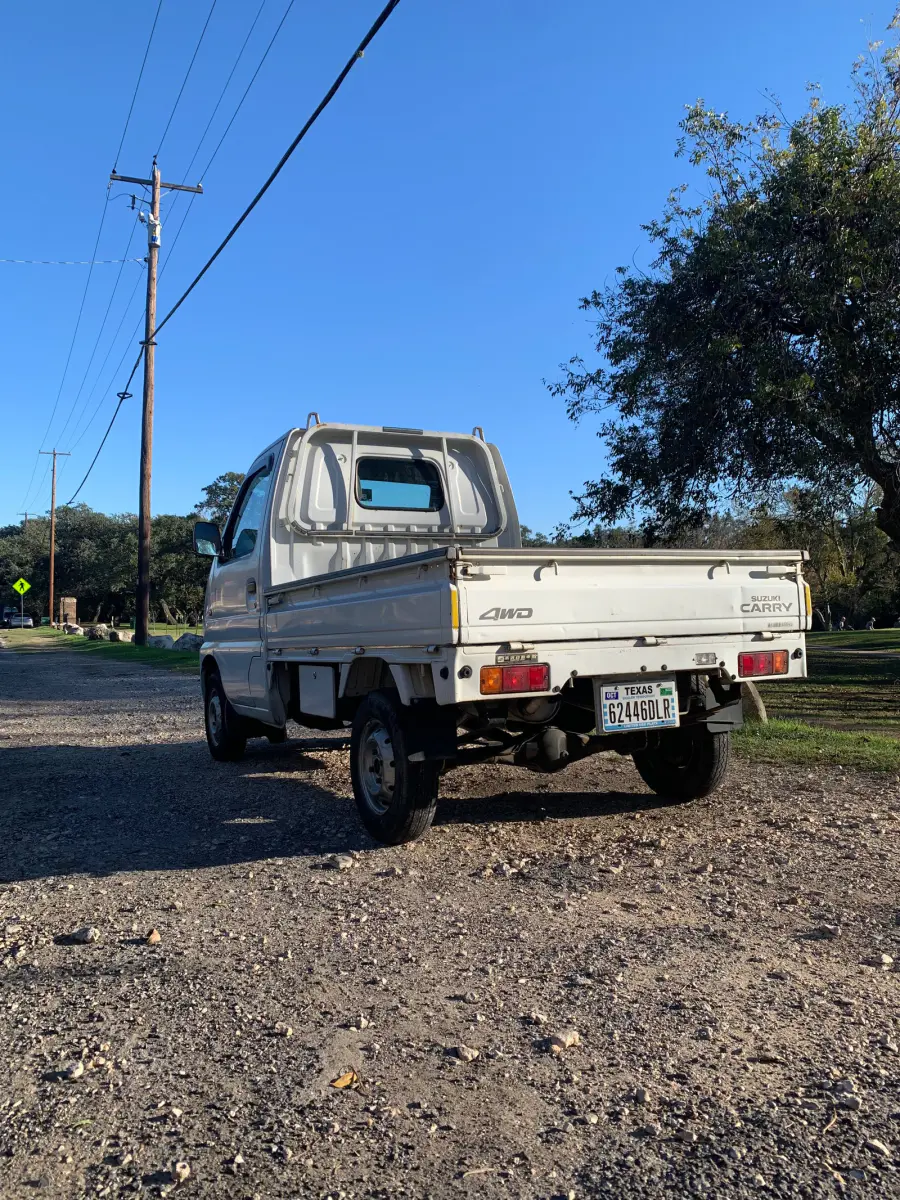 1999 Suzuki Carry, 4WD and AC, a Kei Truck, for sale at Sunshine Imports in Austin, TX (photo 4 of 10)