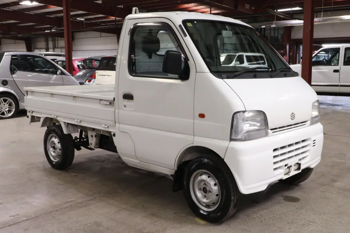White 1999 Suzuki Carry 4x4 Kei Truck, front three-quarter view, for sale at Duncan Imports in Christiansburg, VA