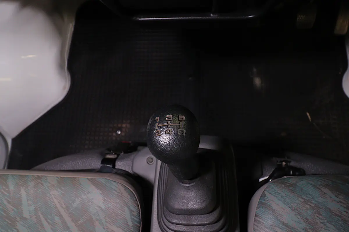 White 1999 Suzuki Carry 4x4 Kei Truck, gear shifter, for sale at Duncan Imports in Christiansburg, VA