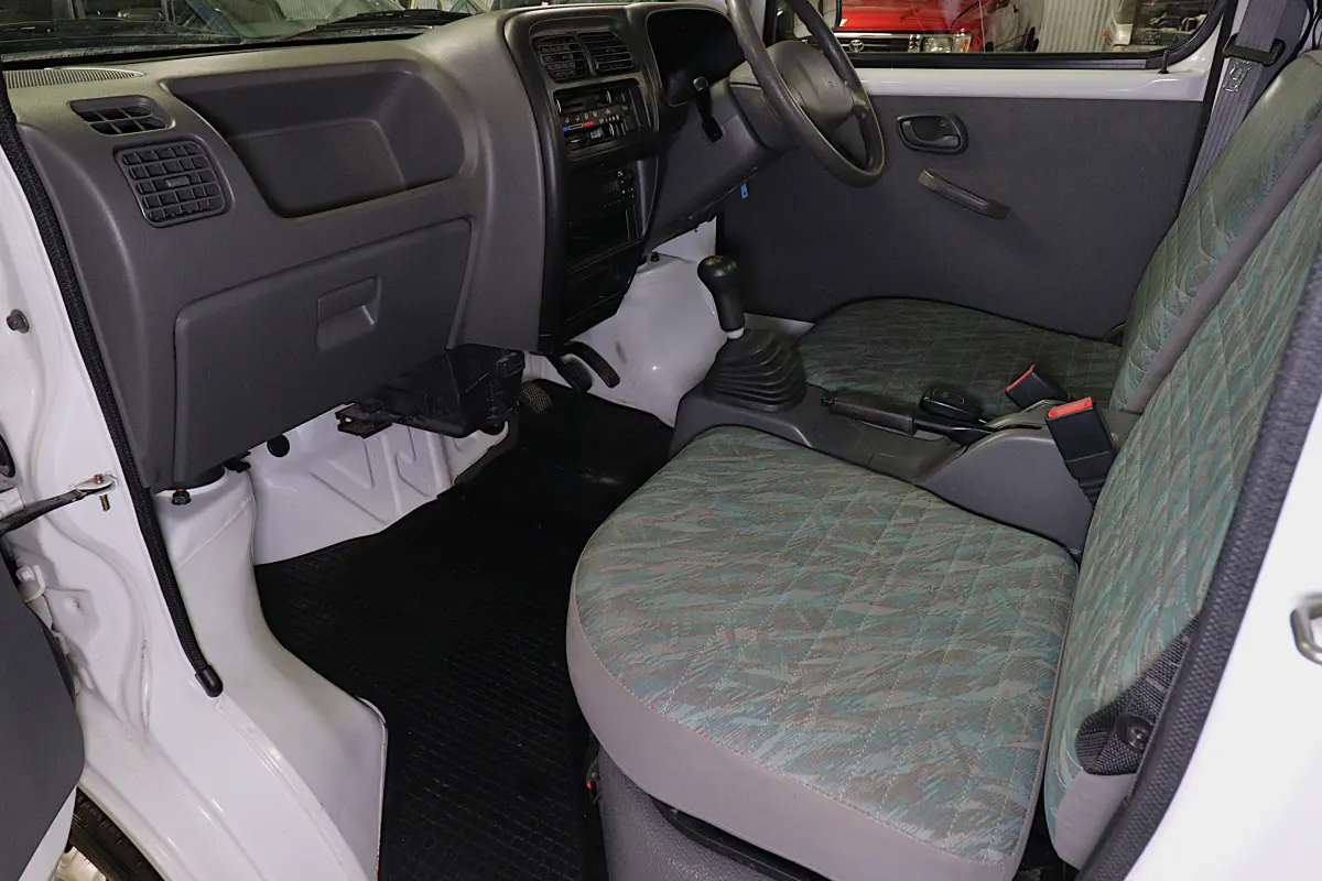 White 1999 Suzuki Carry 4x4 Kei Truck, cab interior with seats, for sale at Duncan Imports in Christiansburg, VA