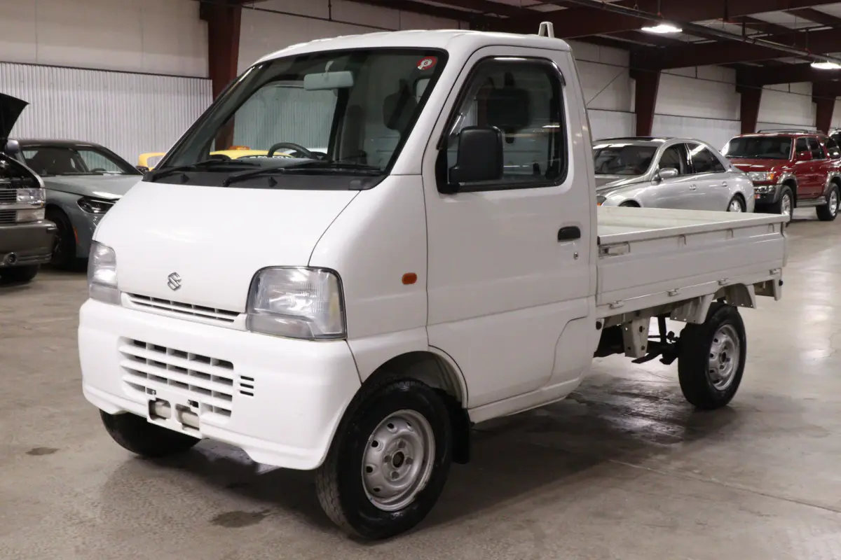 White 1999 Suzuki Carry 4x4 Kei Truck, front three-quarter view, for sale at Duncan Imports in Christiansburg, VA