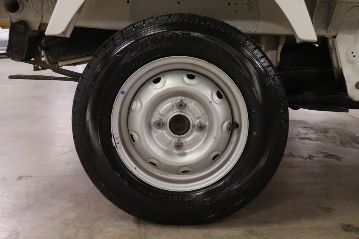 White 1999 Suzuki Carry 4x4 Kei Truck, wheel and tire, for sale at Duncan Imports in Christiansburg, VA