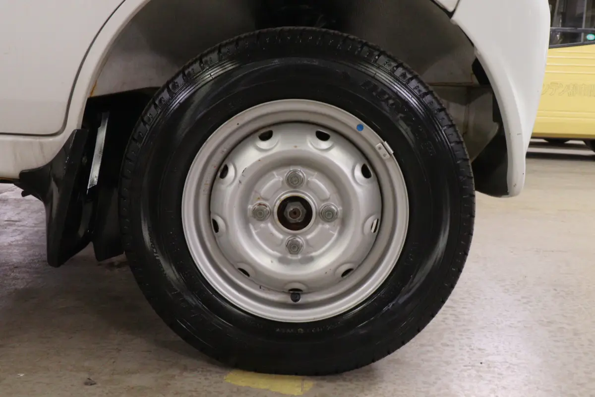 White 1999 Suzuki Carry 4x4 Kei Truck, wheel and tire, for sale at Duncan Imports in Christiansburg, VA