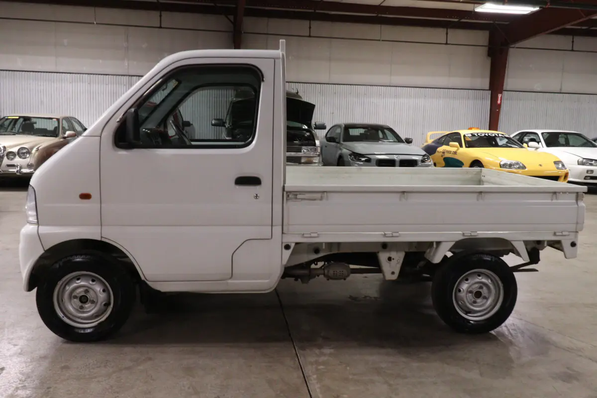 White 1999 Suzuki Carry 4x4 Kei Truck, side view, for sale at Duncan Imports in Christiansburg, VA
