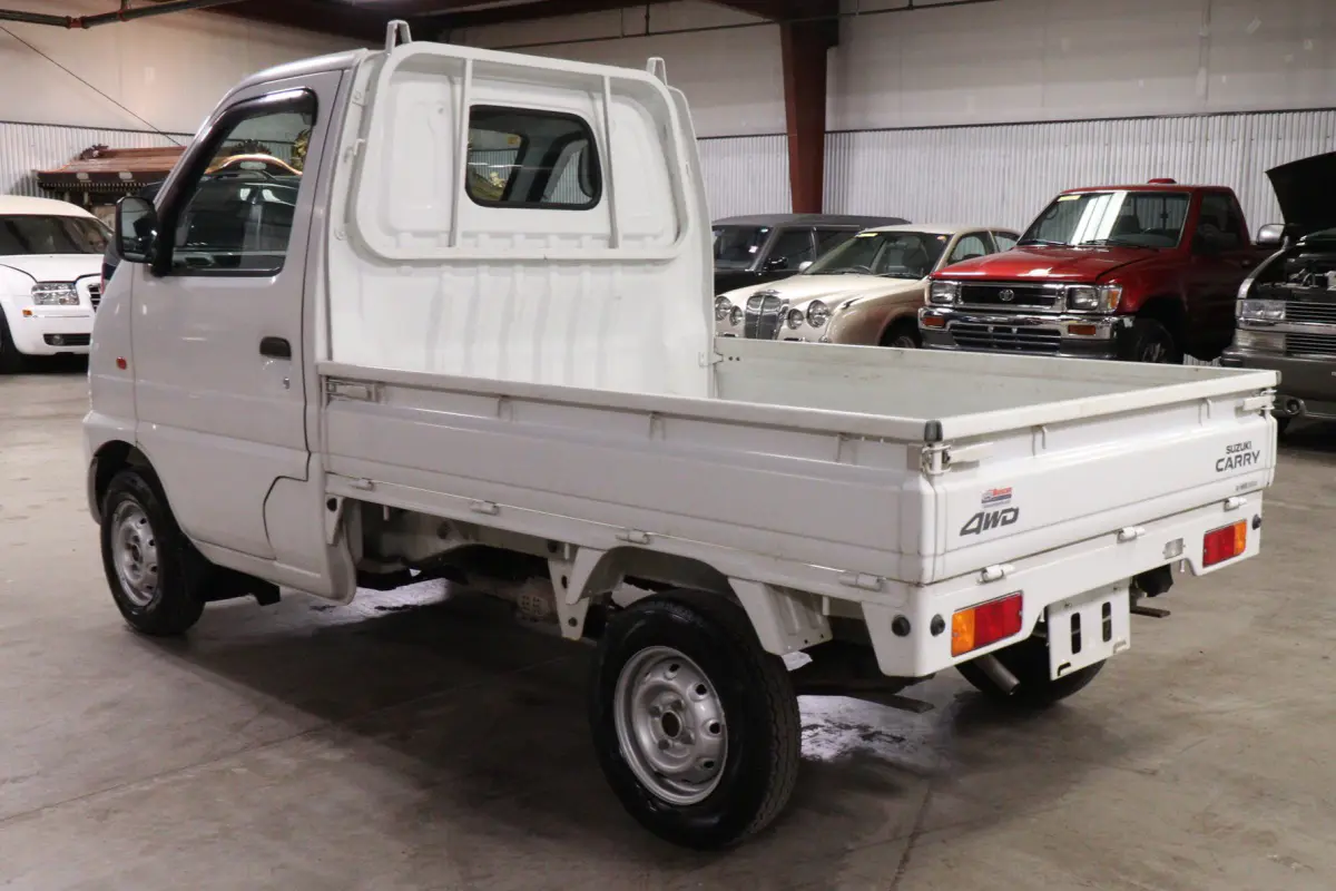 White 1999 Suzuki Carry 4x4 Kei Truck, rear three-quarter view, for sale at Duncan Imports in Christiansburg, VA