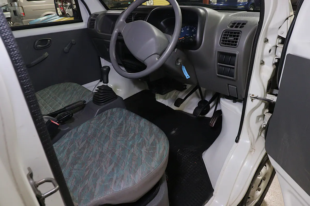 White 1999 Suzuki Carry 4x4 Kei Truck, cab interior, for sale at Duncan Imports in Christiansburg, VA