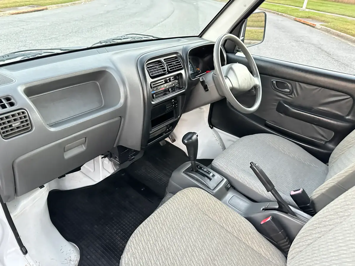 1999 Suzuki Carry Turbo 4WD, a Kei Truck, for sale at Tokyo Motors DC in Boyds, MD (photo 12 of 19)