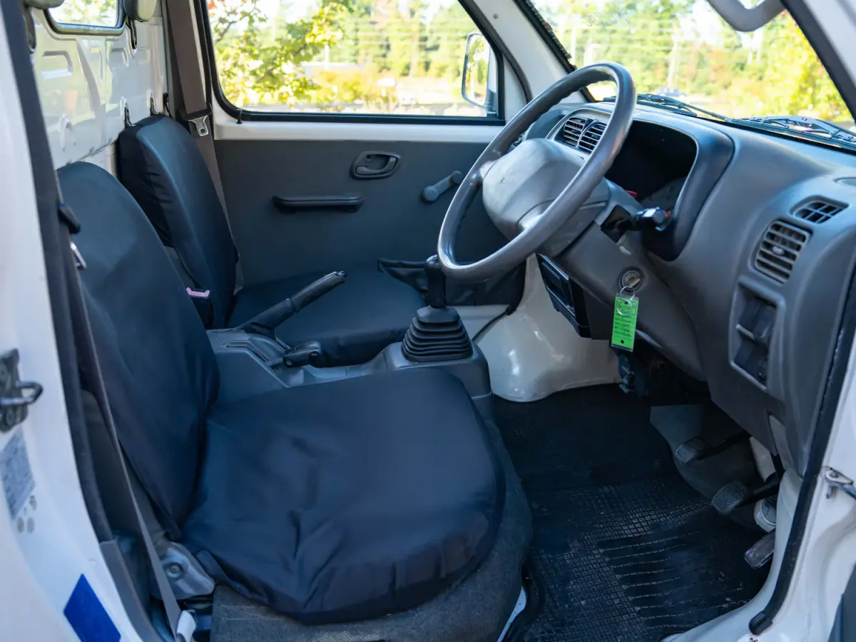 White 2000 Suzuki Carry Dump Bed 4x4 Kei Truck, cab interior, for sale at Japan Direct Motors in Irmo, SC