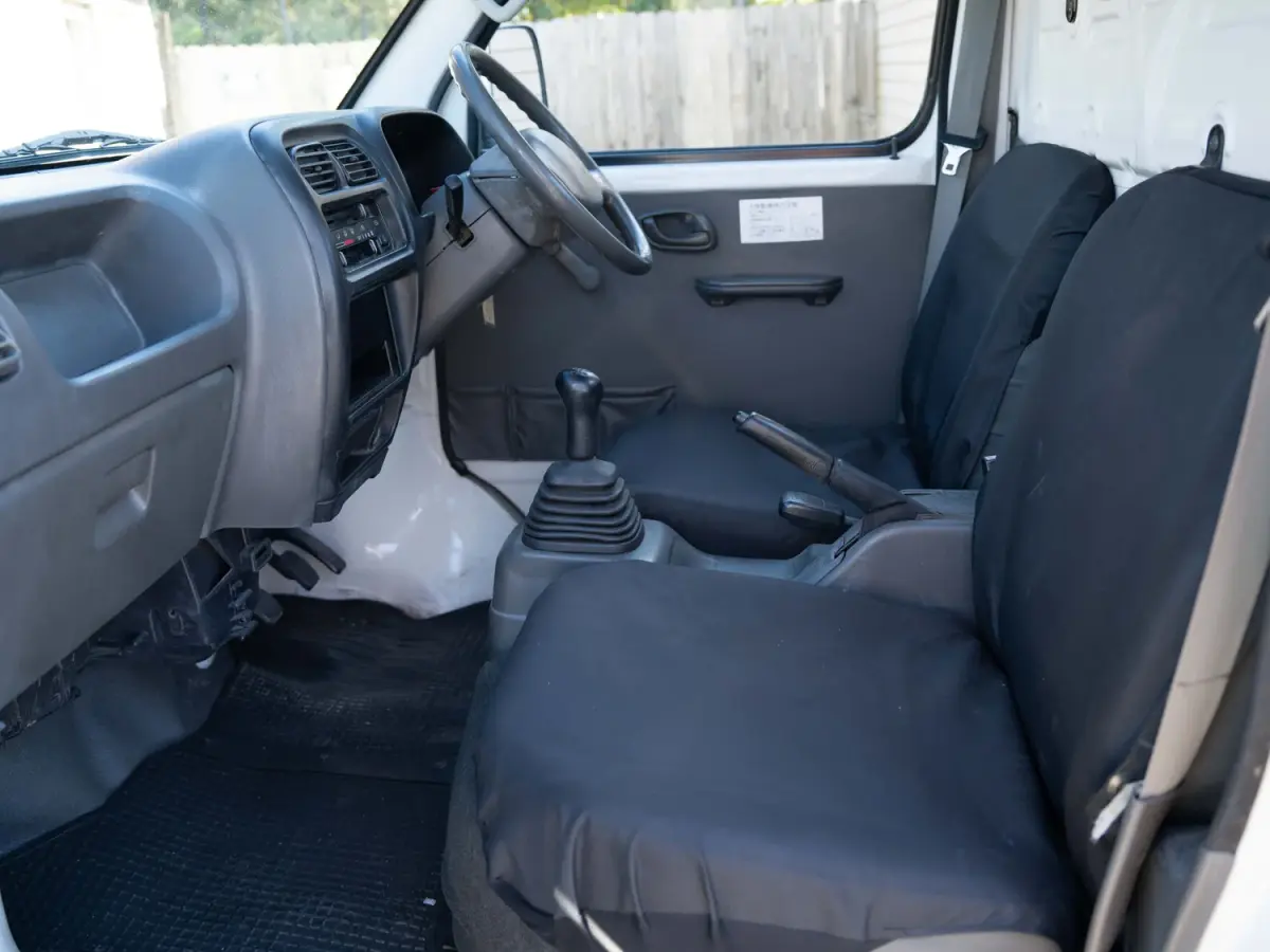 White 2000 Suzuki Carry Dump Bed 4x4 Kei Truck, cab interior, for sale at Japan Direct Motors in Irmo, SC