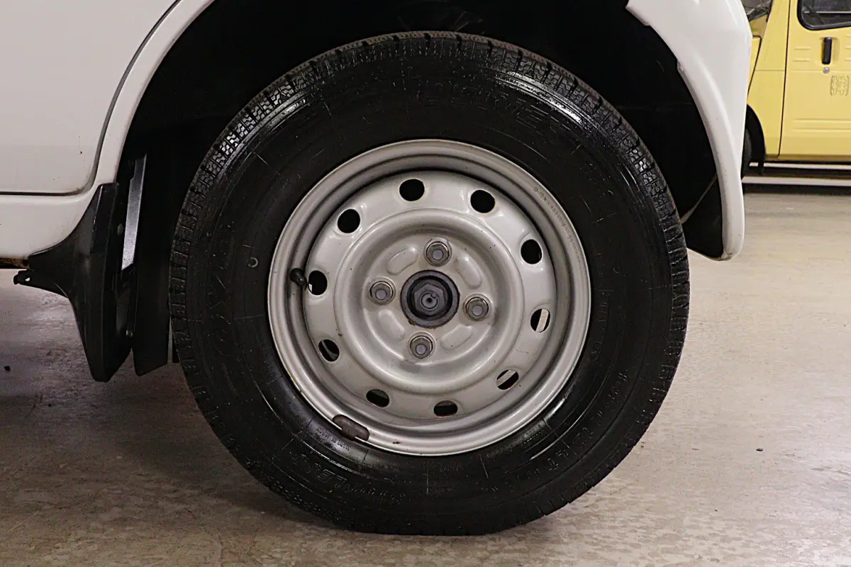 2001 Suzuki Carry 4x4 Kei Truck, front wheel and tire, for sale at Duncan Imports in Christiansburg, VA