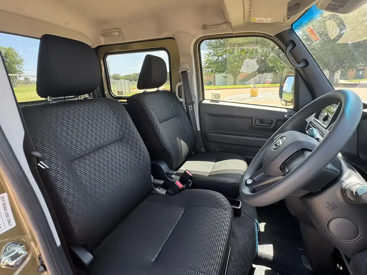 2024 Daihatsu Hijet Deck Van, a khaki green off-road Kei Truck, for sale at Weatherford Mini Trucks in Weatherford, TX (photo 7 of 12)