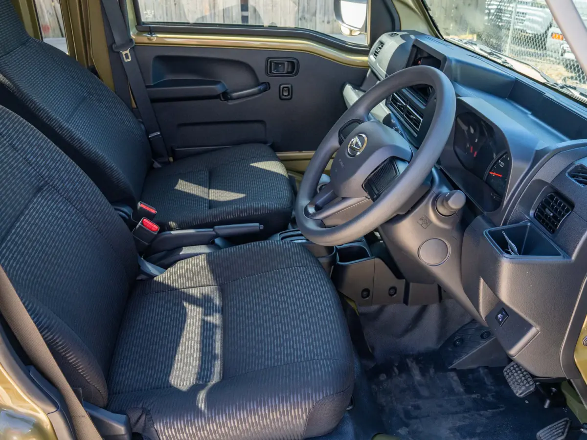 2024 Daihatsu Hijet, a green off-road Kei Truck, for sale at Japan Direct Motors in Irmo, SC (photo 11 of 12)