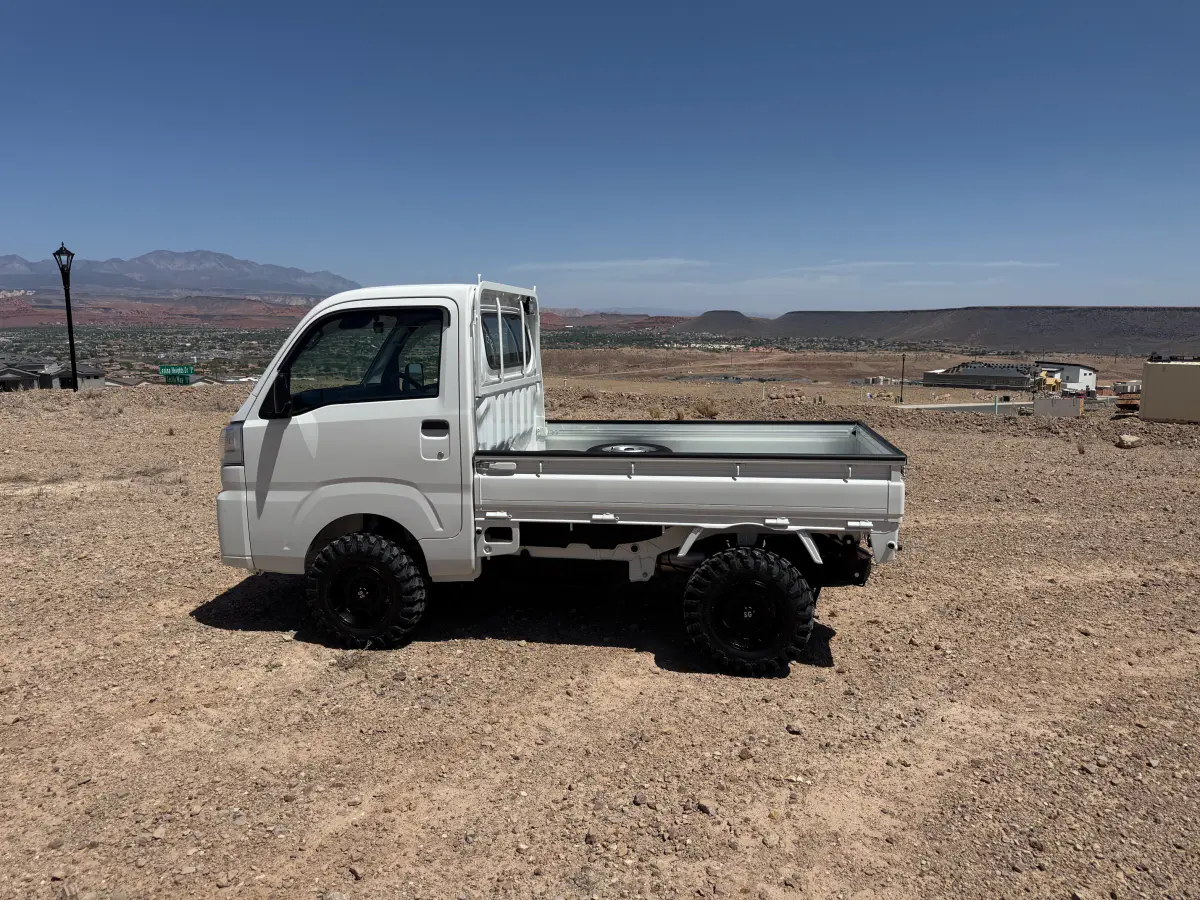 2024 Daihatsu Hijet, a whiteout off-road Kei Truck, for sale at Mini Monsters USA in St. George, UT (photo 4 of 12)