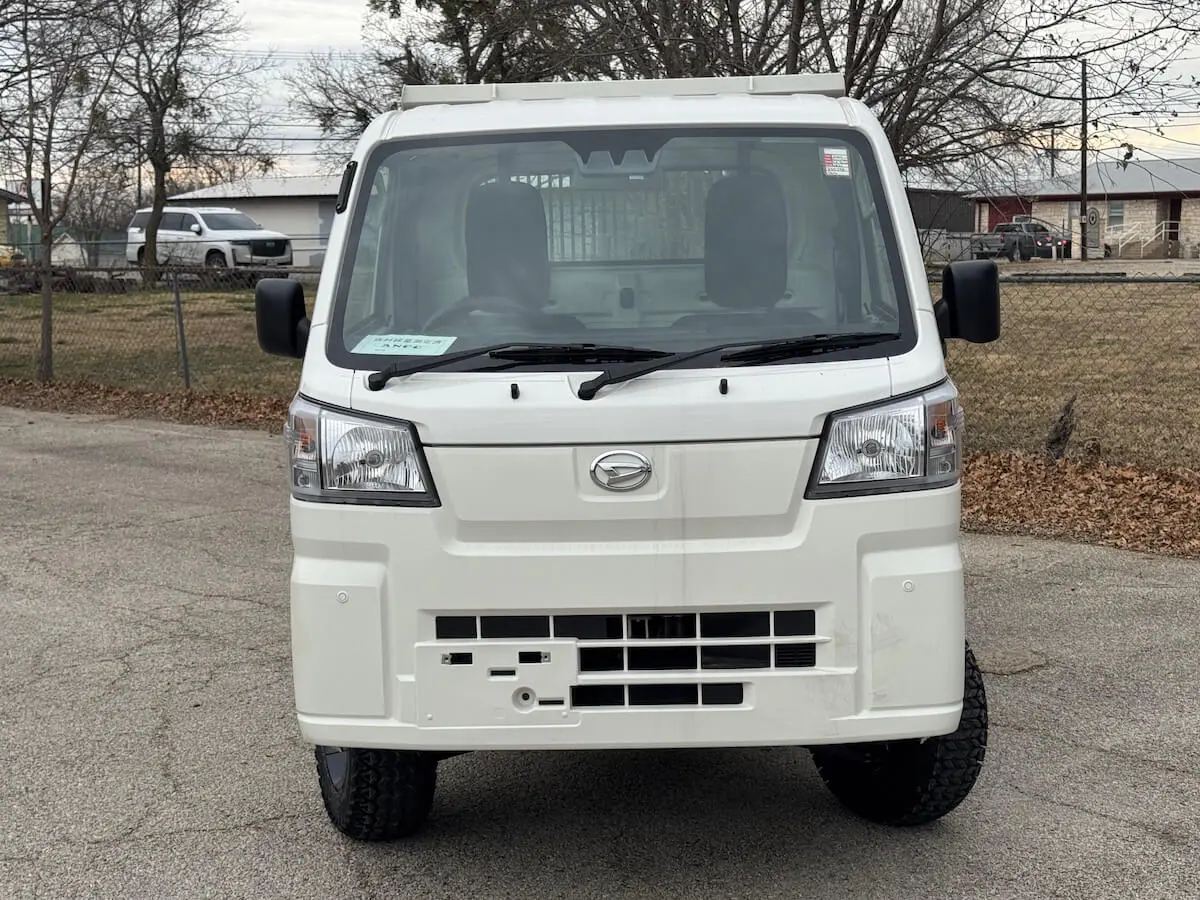 2025 Daihatsu Hijet HD Dump, Automatic 4x4, a white off-road Kei Truck, for sale at Weatherford Mini Trucks in Weatherford, TX (photo 2 of 5)