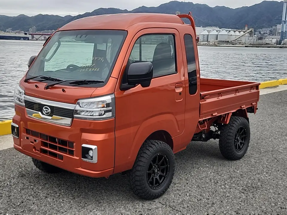 2025 Daihatsu Hijet Jumbo, a desert orange off-road Kei Truck, for sale at Mini Monsters USA in St. George, UT (photo 10 of 12)