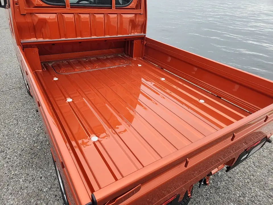 2025 Daihatsu Hijet Jumbo, a desert orange off-road Kei Truck, for sale at Mini Monsters USA in St. George, UT (photo 11 of 12)