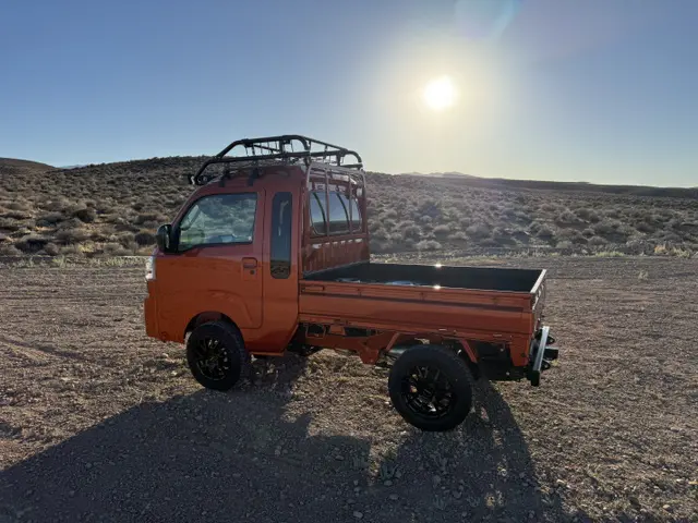 2025 Daihatsu Hijet Jumbo, a desert orange off-road Kei Truck, for sale at Mini Monsters USA in St. George, UT (photo 2 of 12)