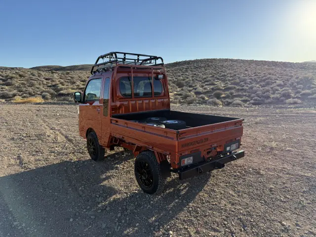 2025 Daihatsu Hijet Jumbo, a desert orange off-road Kei Truck, for sale at Mini Monsters USA in St. George, UT (photo 3 of 12)
