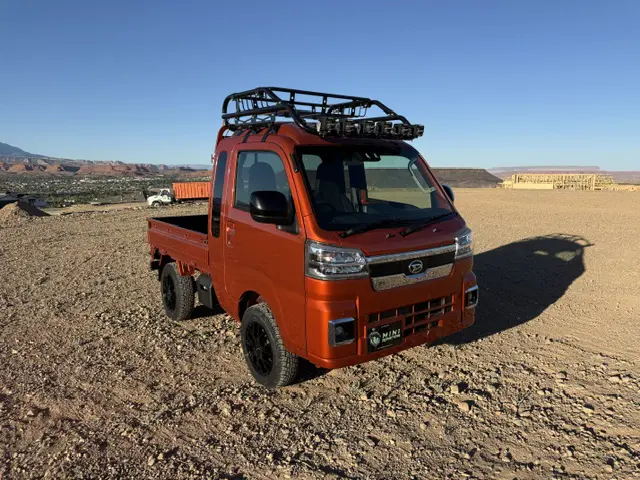 2025 Daihatsu Hijet Jumbo, a desert orange off-road Kei Truck, for sale at Mini Monsters USA in St. George, UT (photo 6 of 12)