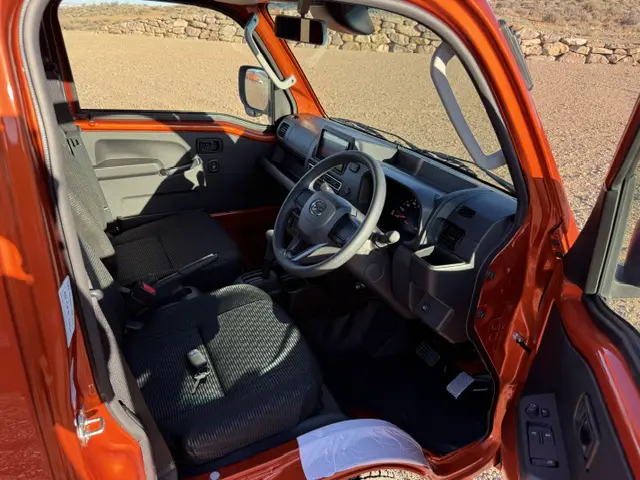 2025 Daihatsu Hijet Jumbo, a desert orange off-road Kei Truck, for sale at Mini Monsters USA in St. George, UT (photo 7 of 12)