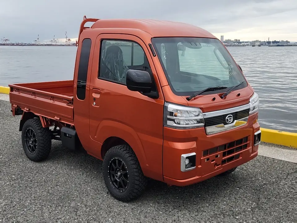 2025 Daihatsu Hijet Jumbo, a desert orange off-road Kei Truck, for sale at Mini Monsters USA in St. George, UT (photo 8 of 12)