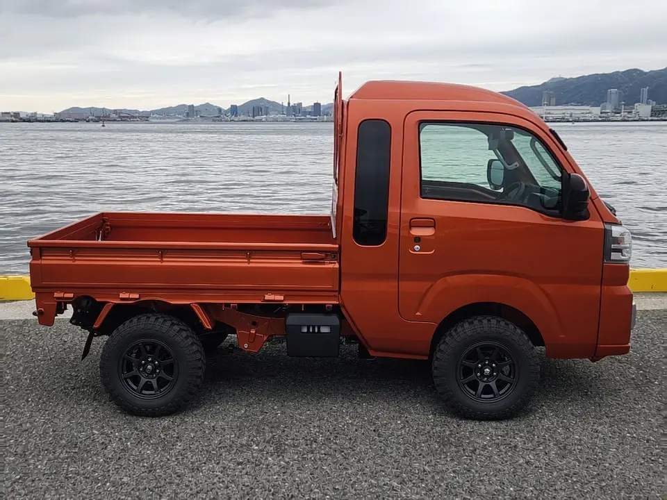 2025 Daihatsu Hijet Jumbo, a desert orange off-road Kei Truck, for sale at Mini Monsters USA in St. George, UT (photo 9 of 12)