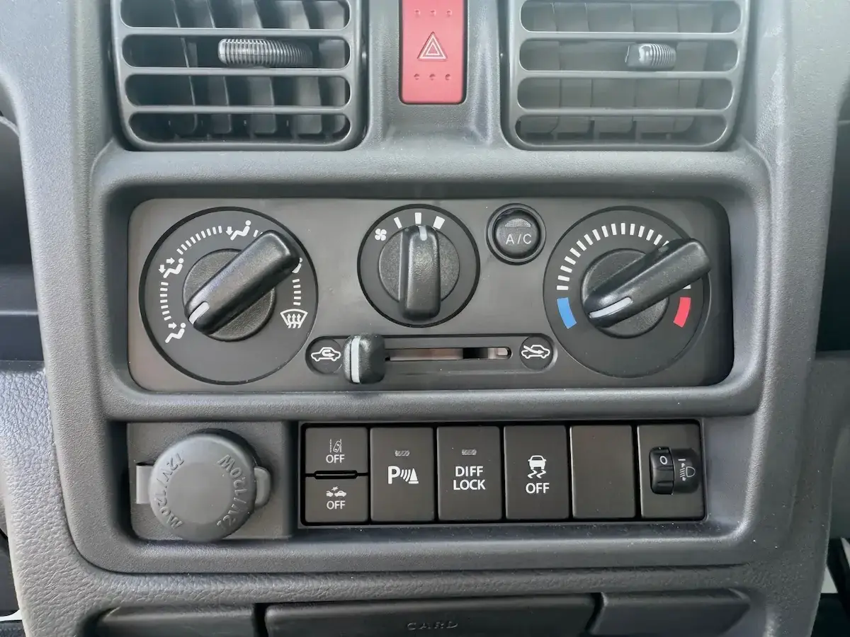 2025 Suzuki Carry Scissor/Dump Bed, a white off-road Kei Truck, for sale at Weatherford Mini Trucks in Weatherford, TX (photo 7 of 12)