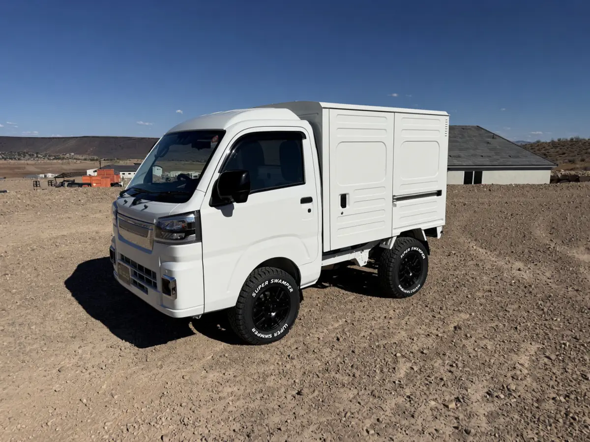 2026 Daihatsu Hijet Box Truck, a white off-road Kei Truck, for sale at Mini Monsters USA in St. George, UT (photo 2 of 12)