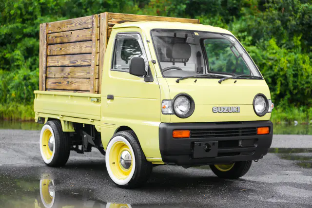 1994 Suzuki Carry, a yellow Kei Truck, for sale at Street Legal Mini Trucks in Philadelphia, PA