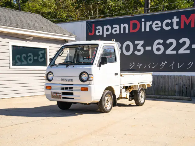 White 1995 Suzuki Carry 4x4 Kei Truck, front three-quarter view, for sale at Japan Direct Motors in Irmo, SC