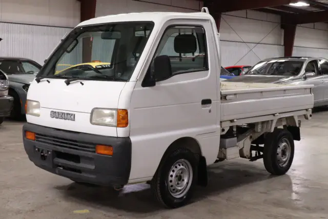 White 1996 Suzuki Carry Dump Bed 4x4 Kei Truck, front three-quarter view, for sale at Duncan Imports in Christiansburg, VA