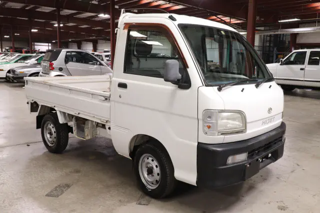 White 1999 Daihatsu Hijet 4x4 Kei Truck, front three-quarter view, for sale at Duncan Imports in Christiansburg, VA