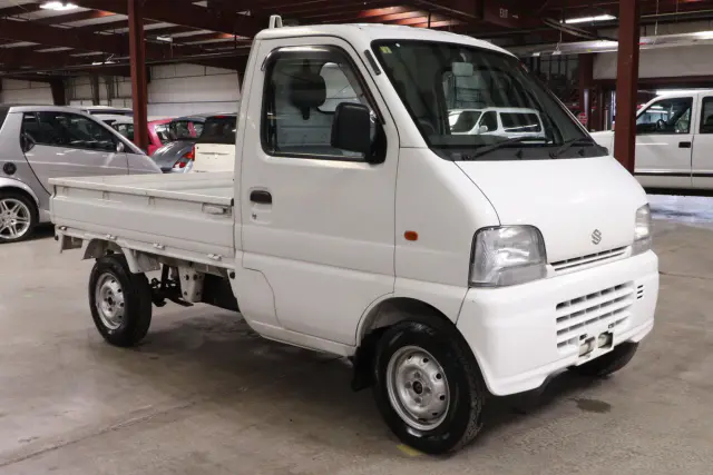 White 1999 Suzuki Carry 4x4 Kei Truck, front three-quarter view, for sale at Duncan Imports in Christiansburg, VA