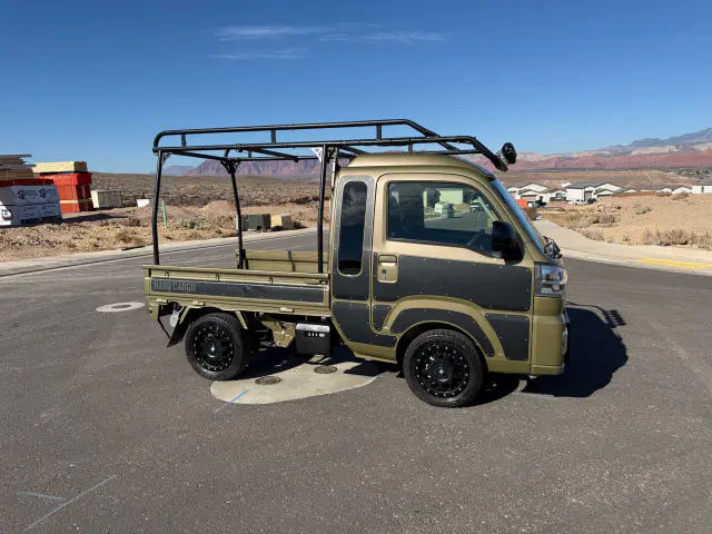 2023 Daihatsu Hijet Jumbo, a black off-road Kei Truck, for sale at Mini Monsters USA in St. George, UT