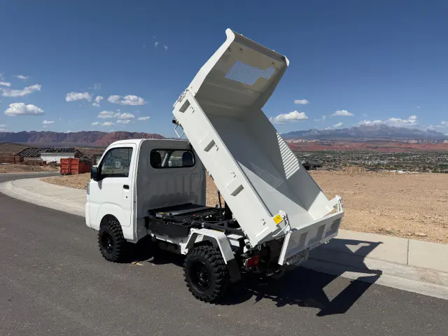 2025 Daihatsu Hijet HD Dump, a whiteout off-road Kei Truck, for sale at Mini Monsters USA in St. George, UT