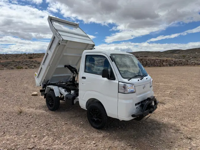 2025 Daihatsu Hijet HD Dump, a whiteout off-road Kei Truck, for sale at Mini Monsters USA in St. George, UT
