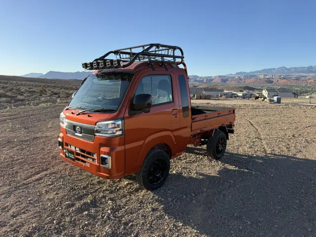 2025 Daihatsu Hijet Jumbo, a desert orange off-road Kei Truck, for sale at Mini Monsters USA in St. George, UT