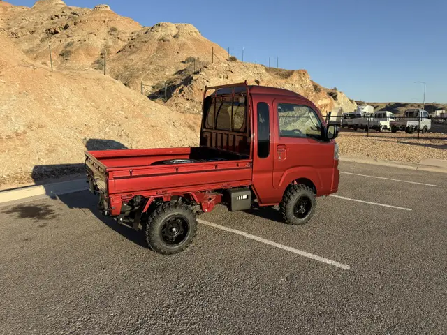 2025 Daihatsu Hijet Jumbo, a red off-road Kei Truck, for sale at Mini Monsters USA in St. George, UT